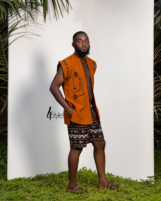 bent orange crepe to and African print shorts.